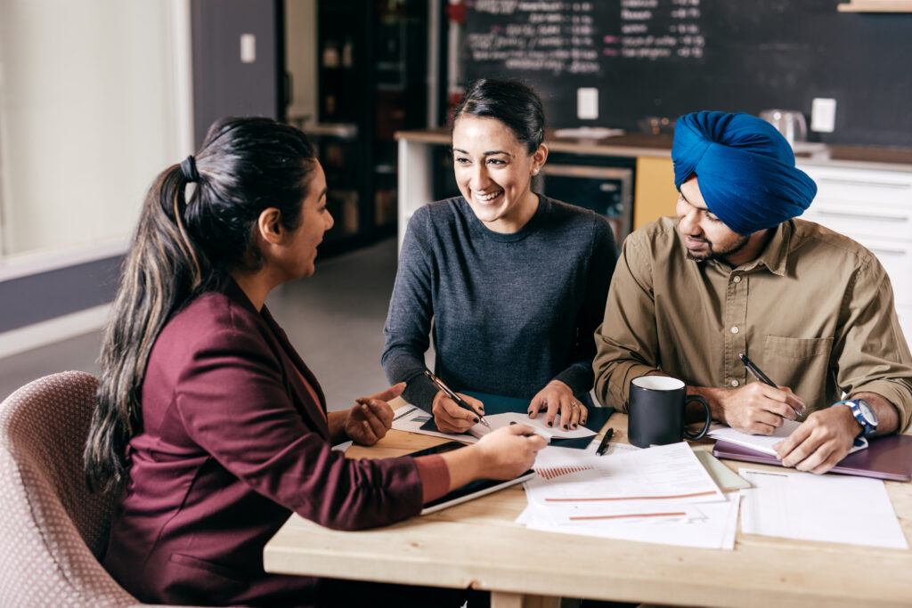 A group sitting around table discussing Local SEO